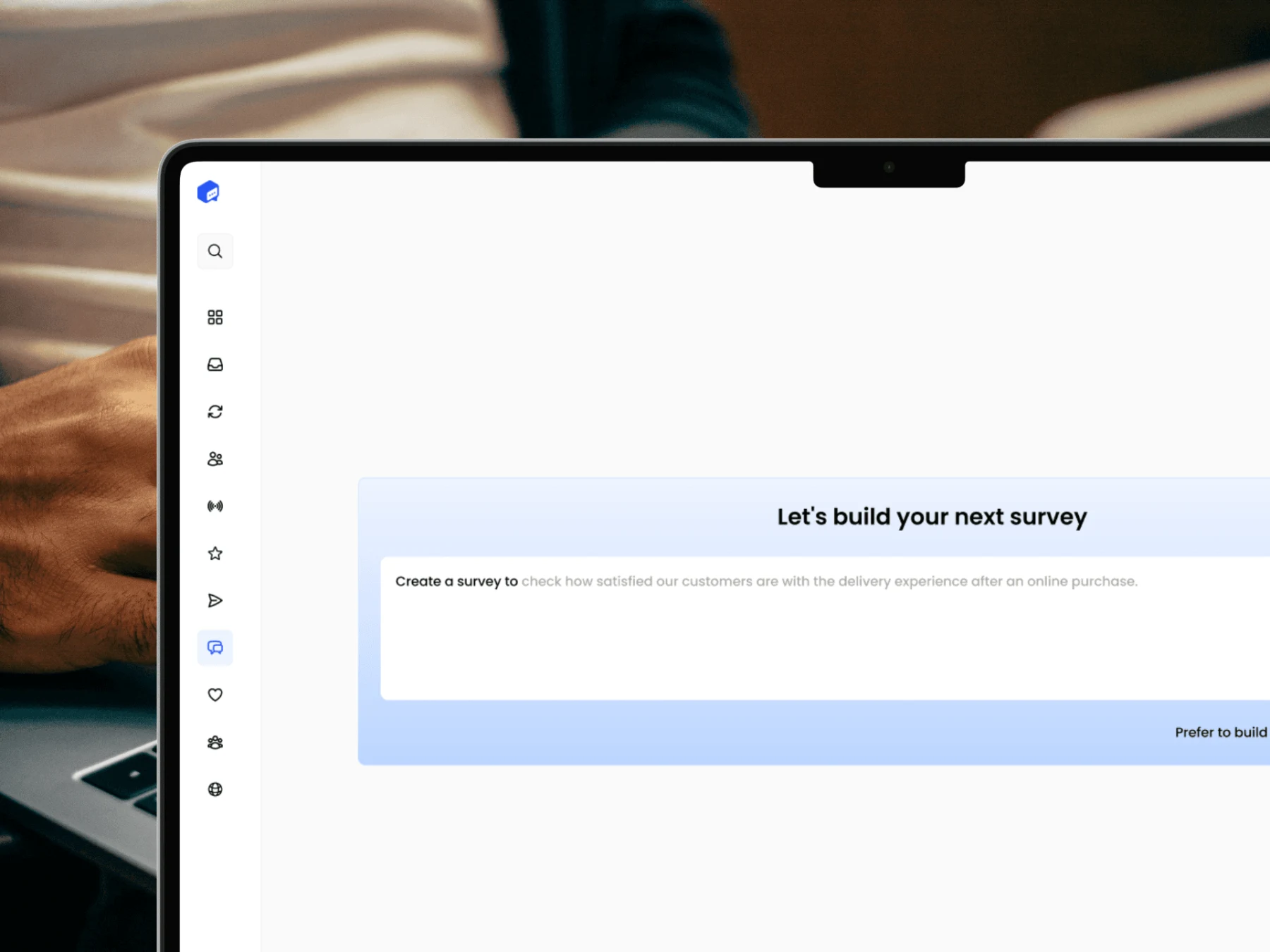 Screenshot of FeedbackRobot's AI-powered survey builder with a prompt field for generating surveys, displayed on a laptop.